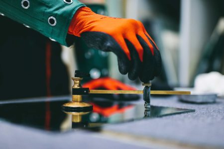 glazier-worker-cutting-glass-with-compass-glass-cu-2026-01-09-11-18-16-utc