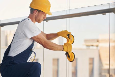 using-tool-young-man-working-in-uniform-at-constr-2026-03-24-03-24-02-utc